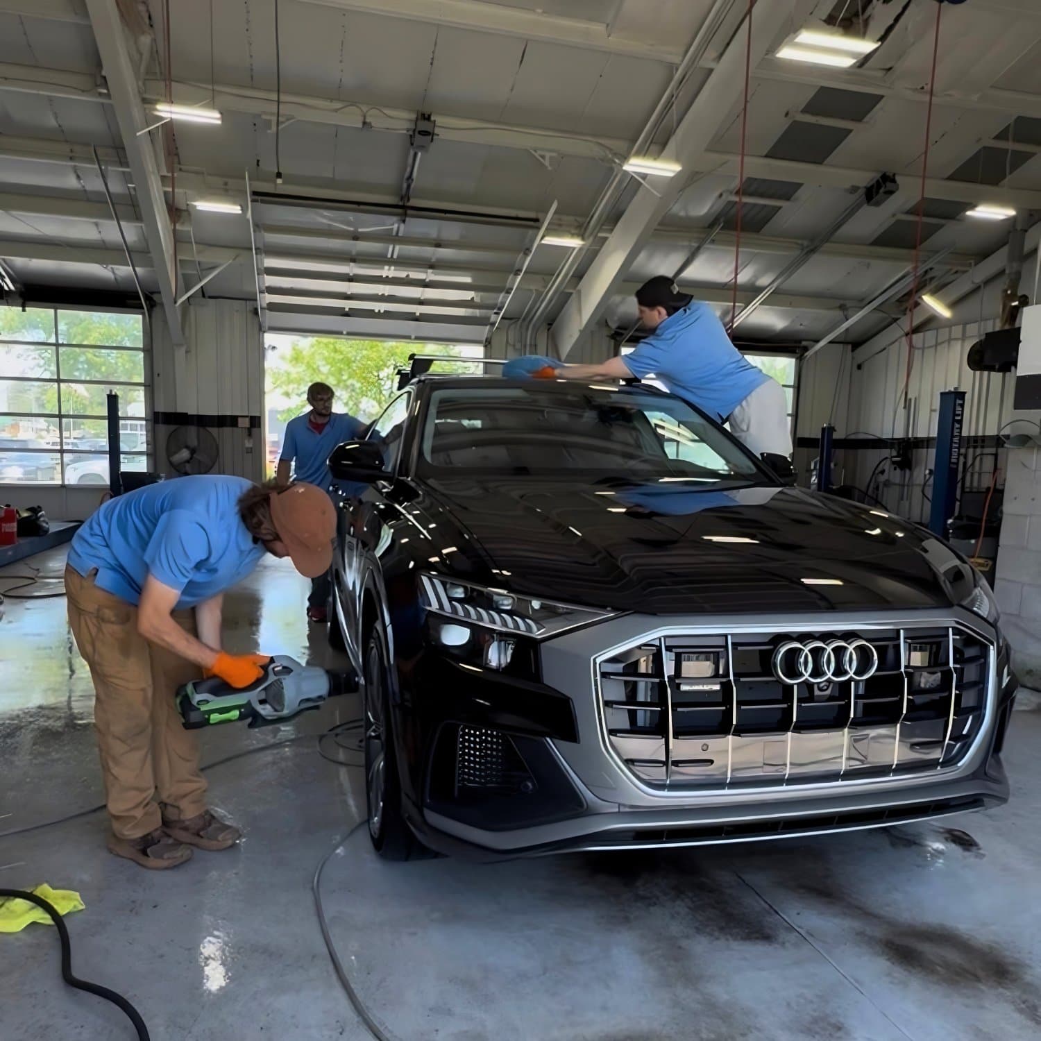 KBC team detailing an Audi in the shop