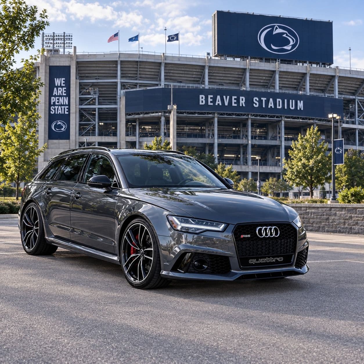 A dark gray Audi RS6 wagon in front of Beaver Stadium.